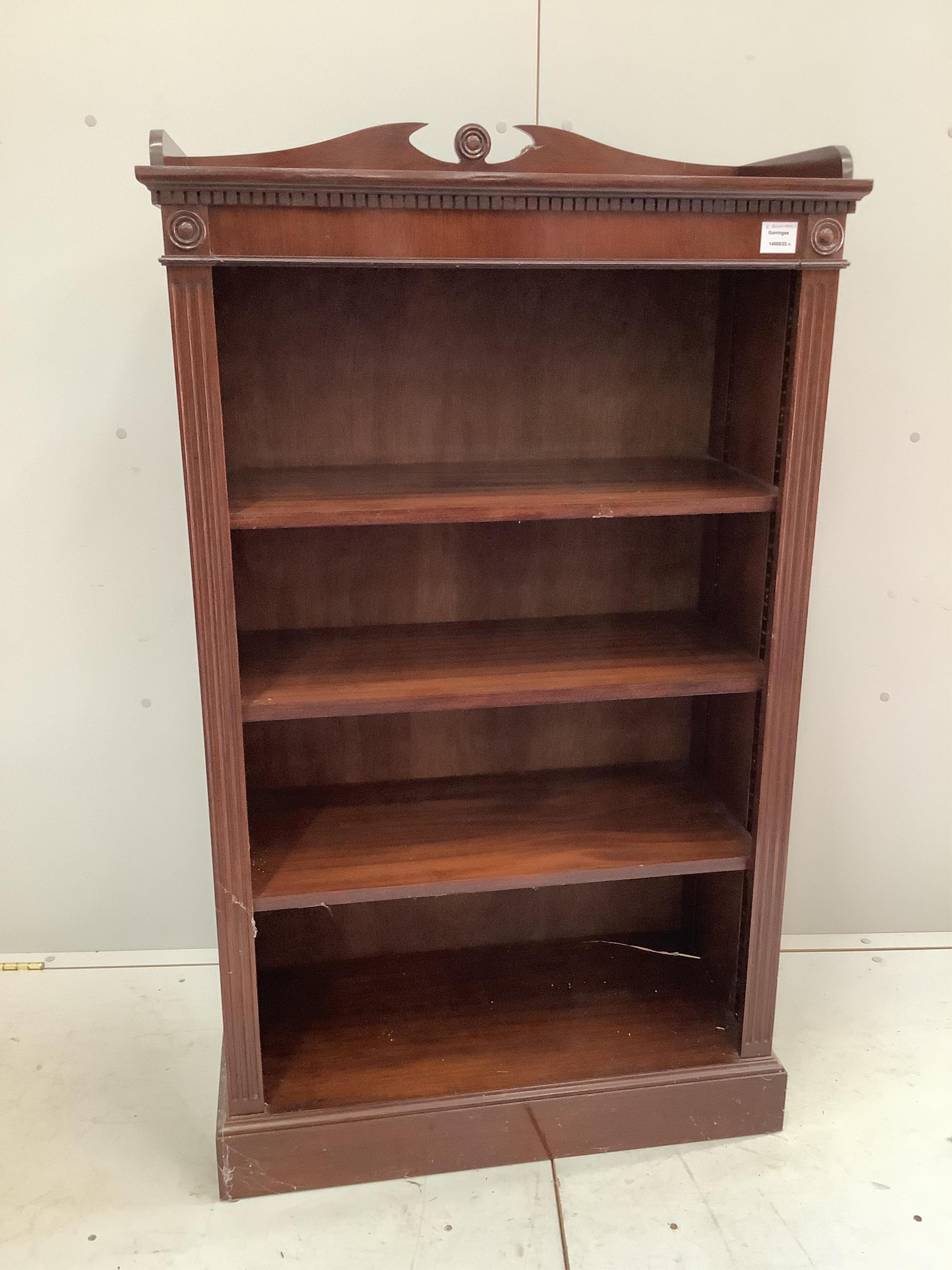 A George III style narrow mahogany open shelf bookcase, width 76cm, depth 35cm, height 131cm. Condition - good